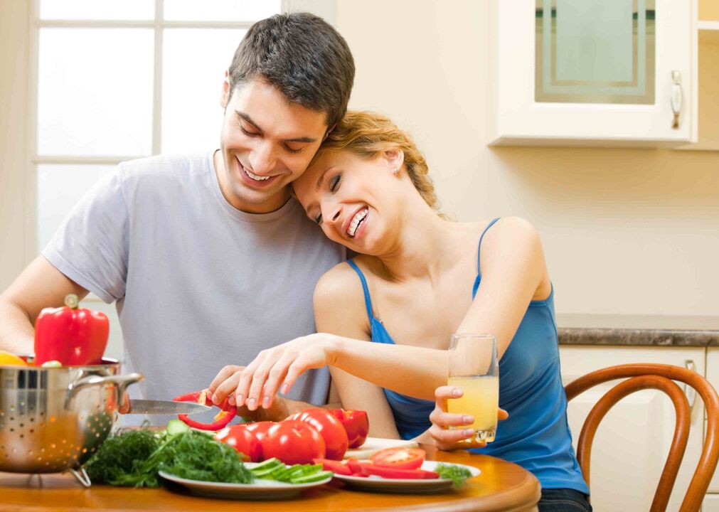 a couple prepares vegetables to increase male potency